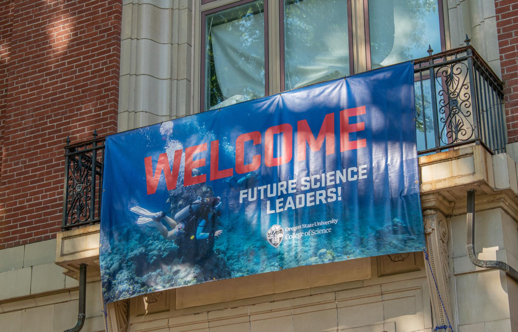 The banner used at the 2021 Fall Social hanging from Kidder Hall that reads "Welcome future science leaders!"